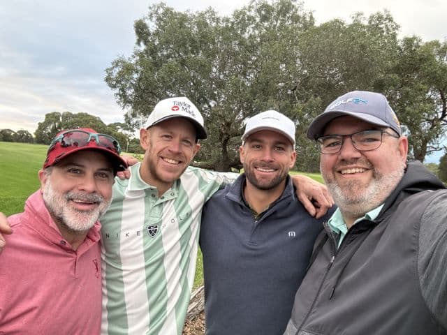 Four players on the fairway after their match