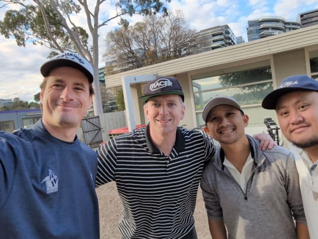 Four players outside the clubhouse
