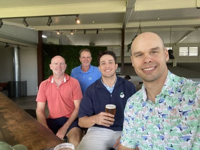 Four players at the bar after the round